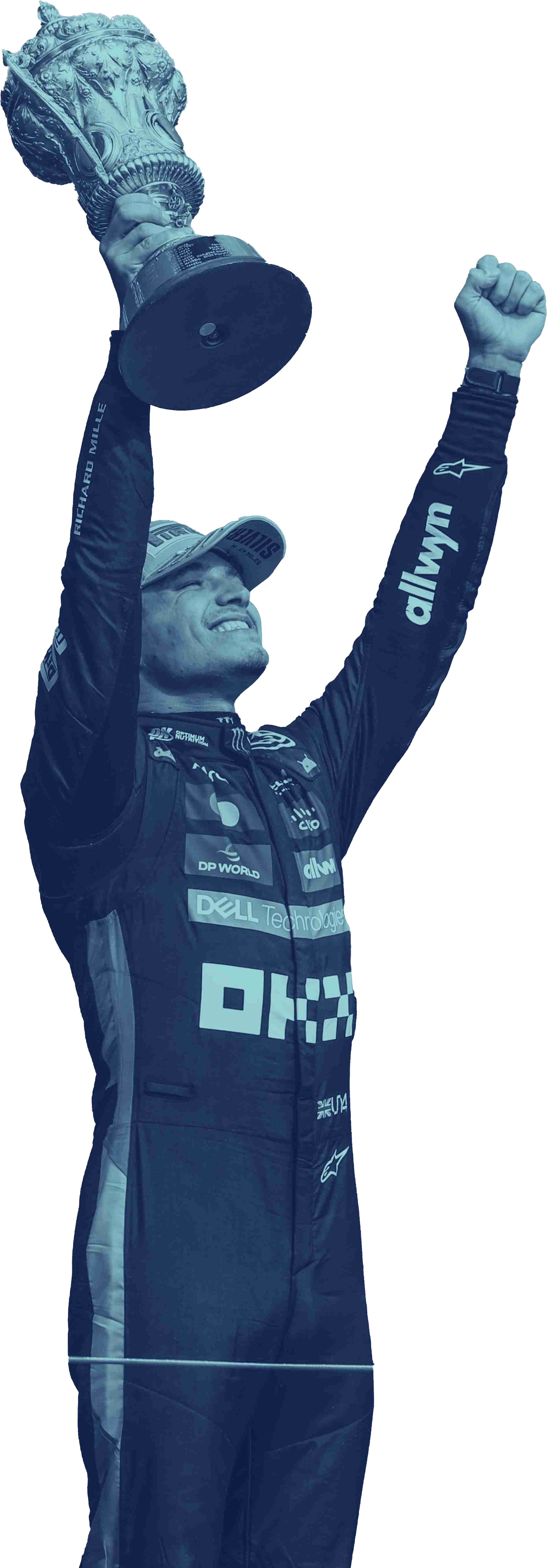 Race car driver in a racing suit and cap raising a trophy with one hand and fist in the air in celebration.