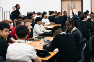 Group of young people in school at the Race for Diversity event at the London Design and Engineering Workshop.